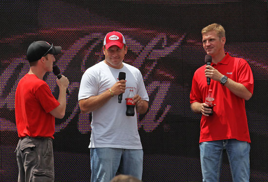NASCAR Sprint Cup Series drivers Clint Bowyer (right) and Ryan Newman (center) answer fan questions during a Q&A at the Coca-Cola Track Walk and Summer Celebration Cookout on Friday at Charlotte Motor Speedway in Concord, N.C. (Credit: HHP)