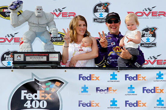 Accepting the Miles the Monster trophy in Sunoco Victory Lane are Katie and Matt Kenseth and their daughter Kaylin Nicola after winning the NASCAR Sprint Cup Series race on Sunday at Dover International Speedway in Dover, Del. (Credit: Todd Warshaw/Getty Images for NASCAR)