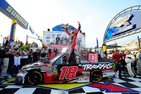 Kyle Busch and the No. 18 Kyle Busch Motorsports team celebrate after winning the NASCAR Camping World Truck Series Lucas Oil 200 on Friday at Dover International Speedway in Dover, Del. (Credit: Jason Smith/Getty Images for NASCAR)