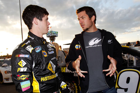 Ryan Truex gets advice from older brother Martin before the start of the the BUBBA Burger 250 at Richmond International Raceway. Truex ended up posting his first career top-10 finish. (Credit: Todd Warshaw/Getty Images for NASCAR)