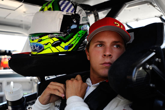 Trevor Bayne gets behind the wheel of his NASCAR Nationwide Series car during practice at Michigan International Speedway on Friday. Bayne returns to the NASCAR Sprint Cup Series this week for the first time in nearly two months. (Credit: Jason Smith/Getty Images for NASCAR)