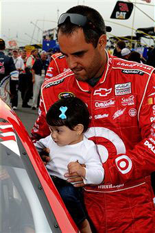 Juan Pablo Montoya, driver of the #42 Target Chevrolet, holds his daughter Manuela on the grid prior to the NASCAR Sprint Cup Series 5-Hour Energy 500 at Pocono Raceway on June 12, 2011 in Long Pond, Pennsylvania. (Photo by John Harrelson/Getty Images)