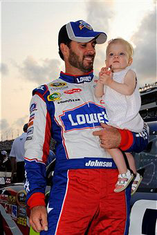 Jimmie Johnson, driver of the #48 Lowe's Summer Salute Chevrolet, holds his daughter Genevieve Marie on the grid prior to the start of the NASCAR Sprint Cup Series Coke ZERO 400 Powered by Coca-Cola at Daytona International Speedway on July 2, 2011 in Daytona Beach, Florida. (Photo by Jared C. Tilton/Getty Images) 