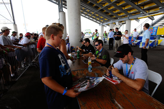 NASCAR Camping World Truck Series drivers signed autographs for fans before the start of the Coca-Cola 200 presented by Hy-Vee at Iowa Speedway on July 16 in Newton, Ia. (Credit: Jason Smith/Getty Images)