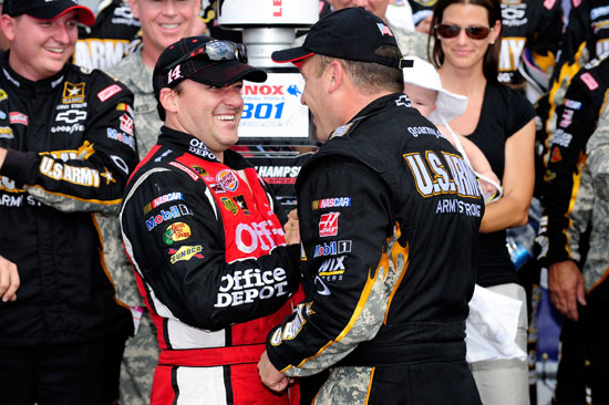 Ryan Newman is congratulated in Victory Lane by owner and teammate Tony Stewart after the duo finished first and second in the NASCAR Sprint Cup Series Lenox Industrial Tools 301 on Sunday at New Hampshire Motor Speedway in Loudon, N.H. (Credit: Jared C. Tilton/Getty Images)