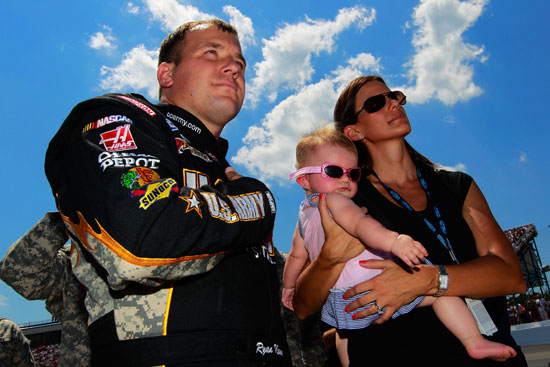 Coors Light Pole Award winner Ryan Newman, daughter Brooklyn Sage and wife Krissie stand together before the NASCAR Sprint Cup Series 19th Annual Lenox Industrial Tools 301 on Sunday at New Hampshire Motor Speedway in Loudon, N.H. (Credit: Geoff Burke/Getty Images for NASCAR)