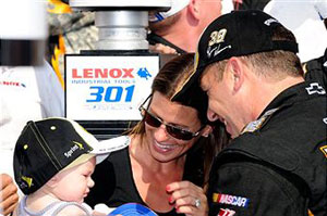 Ryan Newman (R), driver of the #39 U.S. Army Chevrolet, is congratulated by his wife Krissie and their daughter Brooklyn Sage in Victory Lane after Newman won the NASCAR Sprint Cup Series LENOX Industrial Tools 301 at New Hampshire Motor Speedway on July 17, 2011 in Loudon, New Hampshire. (Photo by Jared C. Tilton/Getty Images)