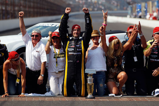 Paul Menard, driver of the No. 27 NIBCO/Menards Chevrolet, celebrates on the bricks after winning the NASCAR Sprint Cup Series Brickyard 400 at Indianapolis Motor Speedway on July 31 in Indianapolis, Ind. (Credit: Chris Graythen/Getty Images)