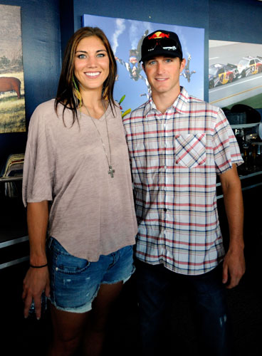 Kasey Kahne (right), driver of the No. 4 Red Bull Toyota, poses with American soccer goalkeeper Hope Solo (left) prior to the NASCAR Sprint Cup Series Brickyard 400 at Indianapolis Motor Speedway on July 31 in Indianapolis, Ind. (Credit: Jason Smith/Getty Images for NASCAR)