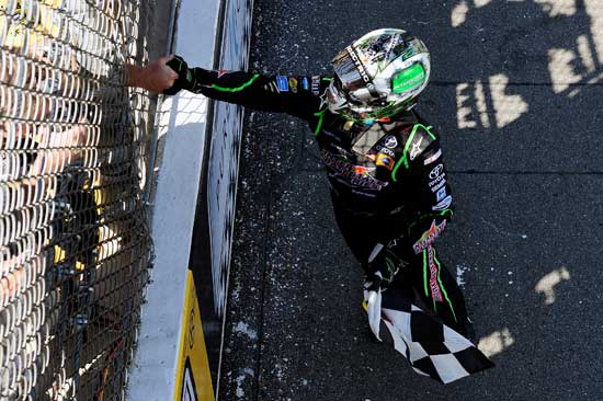 Kyle Busch, driver of the No. 18 Interstate Batteries Toyota, celebrates after winning the NASCAR Sprint Cup Series Pure Michigan 400 at Michigan International Speedway on Aug. 21 in Brooklyn, Mich. (Credit: Jared C. Tilton/Getty Images for NASCAR)