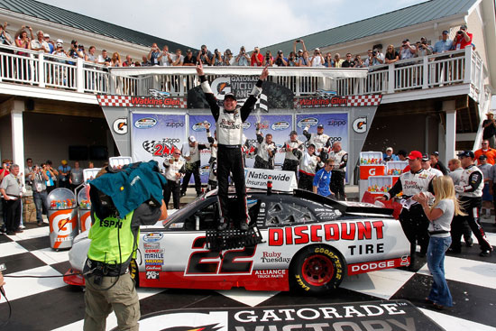 Kurt Busch, driver of the No. 22 Discount Tire/Ruby Tuesday Dodge, celebrates in Victory Lane after winning the NASCAR Nationwide Series Zippo 200 at Watkins Glen International on Aug. 13 in Watkins Glen, N.Y. (Credit: Geoff Burke/Getty Images for NASCAR)