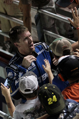 Carl Edwards, driver of the No. 60 Fastenal Ford, celebrates in the grandstand with the fans after winning the NASCAR Nationwide Series Great Clips 300 at Atlanta Motor Speedway on Sept. 3 in Hampton, Ga. (Credit: Brian Cleary/Getty Images)