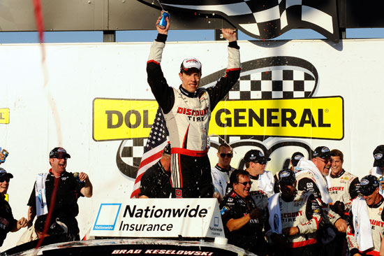 Brad Keselowski, driver of the No. 22 Discount Tire Dodge, celebrates in Victory Lane after winning the NASCAR Nationwide Series Dollar General 300 Powered by Coca-Cola at Chicagoland Speedway on Sept. 17 in Joliet, Ill. (Credit: Jason Smith/Getty Images for NASCAR)