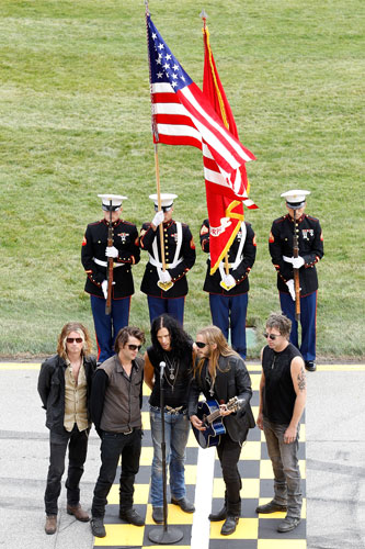 American rock band Red Jumpsuit Apparatus perform the National Anthem prior to the start of the NASCAR Sprint Cup Series GEICO 400 at Chicagoland Speedway on Sept. 19 in Joliet, Ill. (Credit: Todd Warshaw/Getty Images for NASCAR)