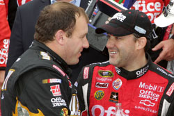 Ryan Newman (left), driver of the No. 39 U.S. Army Medicine Chevrolet, congratulates Tony Stewart (right) in Victory Lane after winning the NASCAR Sprint Cup Series GEICO 400 at Chicagoland Speedway. (Credit: Jerry Markland/Getty Images for NASCAR)