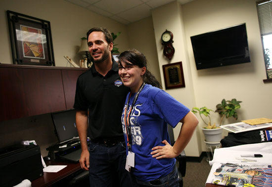Sarah Rusinko (R) had the chance to meet five-time NASCAR Sprint Cup Series champion Jimmie Johnson after she asked him to homecoming during a Texas football-style pep rally at Byron Nelson High School on Wednesday in Trophy Club, Texas. (Credit: Tom Pennington/Getty Images for Texas Motor Speedway)