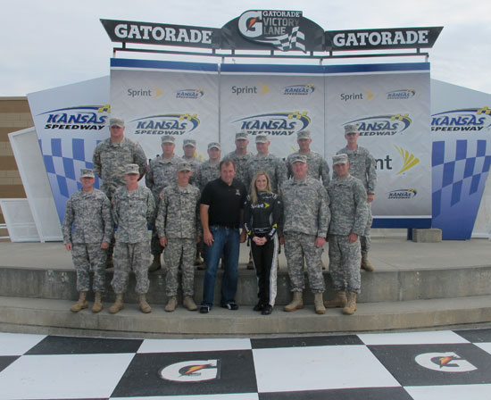 Ryan Newman and Kim Coon pose for a photo with the Ft. Riley soldiers at Kansas Speedway on Sept 14 in Kansas City, Kan. Newman is seeded eighth going into the Chase for the NASCAR Sprint Cup Series. (Credit: Kansas Speedway)