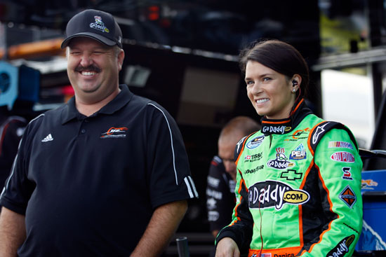 Danica Patrick, driver of the No. 7 GoDaddy.com/GetYour.net Chevrolet, stands with crew chief Tony Eury Jr. in the garage area during practice for the NASCAR Nationwide Series Virginia 529 College Savings 250 at Richmond International Raceway on Sept. 9 in Richmond, Va. (Credit: Chris Graythen/Getty Images)