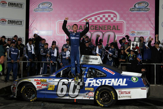 Carl Edwards, driver of the #60 Fastenal Ford, celebrates in Victory Lane after winning the NASCAR Nationwide Series Dollar General 300 Miles of Courage at Charlotte Motor Speedway on October 14, 2011 in Charlotte, North Carolina. (Credit: Jerry Markland/Getty Images for NASCAR)