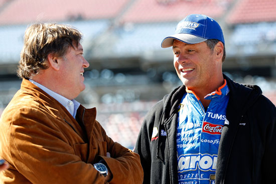 NASCAR Vice President of Competition Robin Pemberton jokes with Michael Waltrip, who qualified 23rd in a tribute car to his brother Darrell's Hall of Fame Induction. (Credit: Geoff Burke/Getty Images for NASCAR)