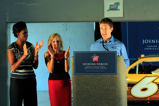 Carl Edwards introduces First Lady Michelle Obama (left) and Dr. Jill Biden at a Joining Forces pre-race event at Homestead-Miami Speedway on Sunday, Nov. 20. (Credit: By Chris Trotman, Getty Images for NASCAR)