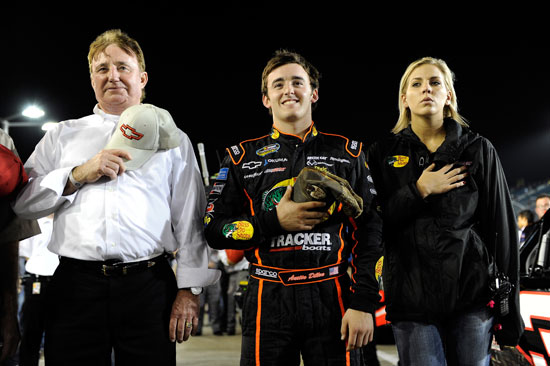 Team owner Richard Childress (left), Austin Dillon (center) and his girlfriend stand on pit road during pre-race ceremonies at Homestead-Miami Speedway in the NASCAR Camping World Truck Series finale. (Credit: By John Harrelson, Getty Images for NASCAR)
