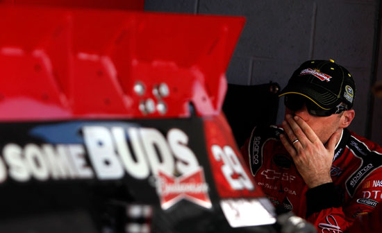 Kevin Harvick watches his crew adjust his No. 29 Chevrolet in the garage area at Homestead-Miami Speedway on Saturday, Nov. 19. (Credit: By Tom Pennington, Getty Images for NASCAR)