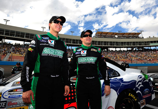 (Left to right) Roush Fenway Racing teammates Trevor Bayne and Ricky Stenhouse Jr. get together on the grid before the NASCAR Nationwide Series Wypall 200 on Saturday at Phoenix International Raceway in Avondale, Ariz. (Credit: Rainier Ehrhardt/Getty Images for NASCAR)