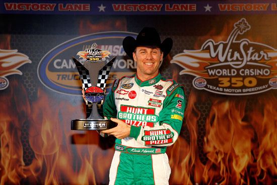 Kevin Harvick, driver of the #2 Hunt Brothers Pizza Chevrolet, poses in Victory Lane after winning the NASCAR Camping World Truck Series WinStar World Casino 350k at Texas Motor Speedway on Nov. 4, 2011, in Fort Worth, Texas. (Credit: Chris Graythen/Getty Images)