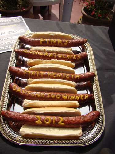 Pink's Hot Dogs in Los Angeles, Calif., presents Daytona 500 champion Matt Kenseth with a hot dog platter of congratulations on Feb. 29, 2012. (Credit: Auto Club Speedway)
