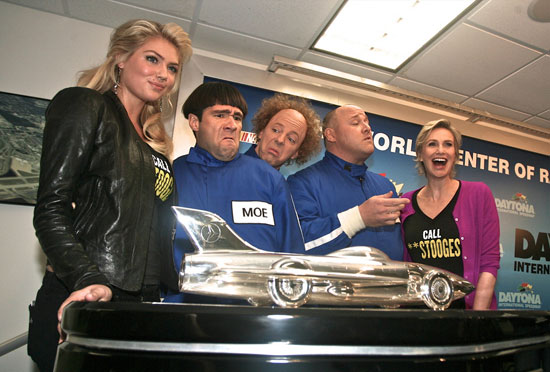 Kate Upton and Jane Lynch pose with The Three Stooges and the Harley J. Earl trophy prior to the 54th running of the Daytona 500. (Credit: ISC Images and Archives)