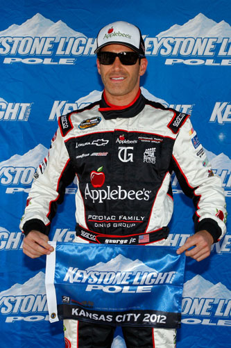 Tim George Jr. celebrates his first career NASCAR Camping World Truck Series Keystone Light Pole Award for the SFP 250 on Saturday at Kansas Speedway in Kansas City, Kan. (Credit: Tyler Barrick/Getty Images)