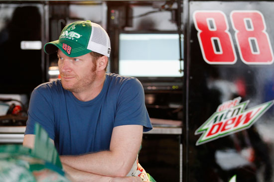 Dale Earnhardt Jr., driver of the #88 AMP Energy/National Guard Chevrolet, looks on in the garage area during practice for the NASCAR Sprint Cup Series FedEx 400 benefiting Autism Speaks at Dover International Speedway on June 1, 2012 in Dover, Delaware. (Photo by Rob Carr/Getty Images for NASCAR)