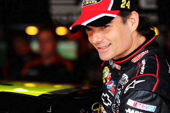 Jeff Gordon, driver of the #24 DuPont Chevrolet, looks on in the garage area during practice for the NASCAR Sprint Cup Series FedEx 400 benefiting Autism Speaks at Dover International Speedway on June 1, 2012 in Dover, Delaware. (Photo by Patrick Smith/Getty Images for NASCAR)